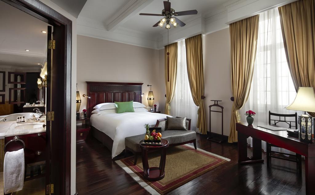 Rooms at Sofitel Legend Metropole Hanoi are rich in hardwoods